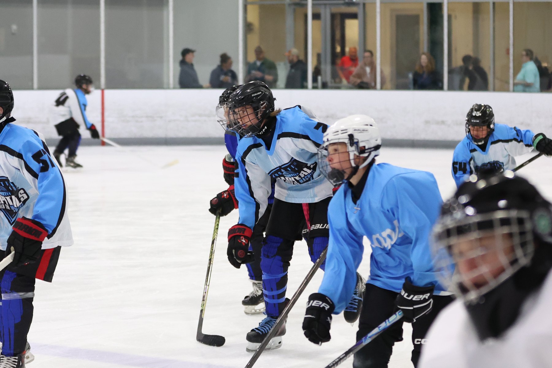 Youth hockey player in game action